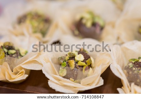 Macro picture of beautiful chocolate candy with peanuts for woman party