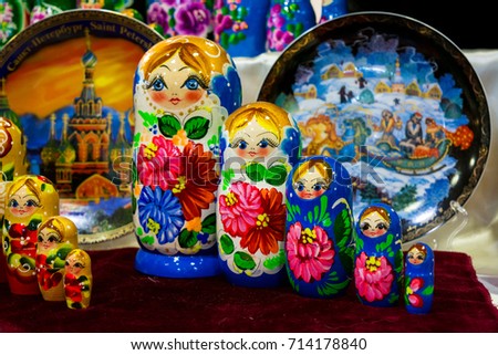 colored matrioskas at the russian shop on blur background