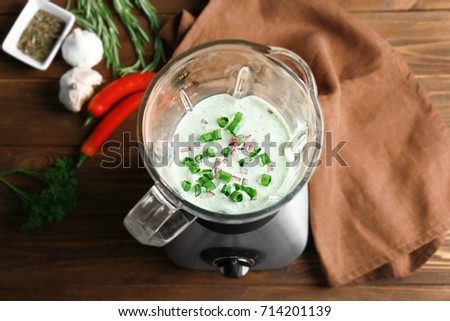Creamy sauce for fish taco in blender on kitchen table