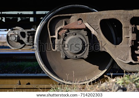 Detailed photo of railway freight car. A fragment of the component parts of the freight car on the railroad in daylight