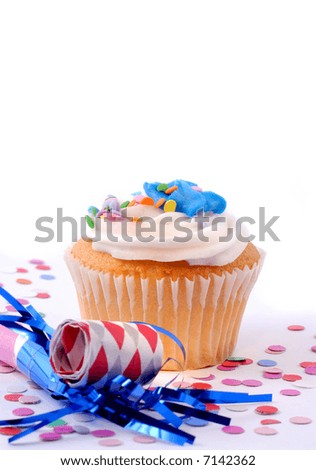 Cupcake, Confetti And Blowout Ready For A New Years Celebration Party, Copy Space For Your Message