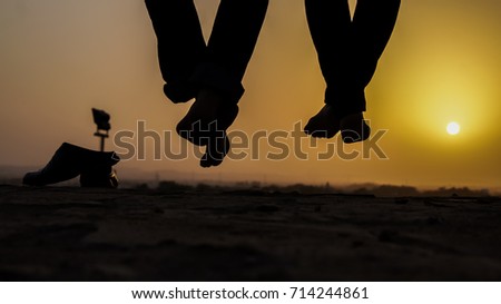 romantic couple  silhouette sunset background