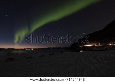 Aurora borealis (Polar lights) over the mountains in the North of Europe - Narvik, Norway