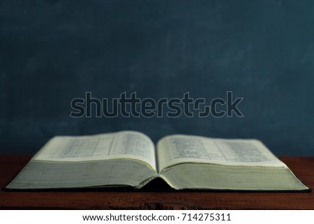 Bible on an old table. Beautiful background.Religion concept.