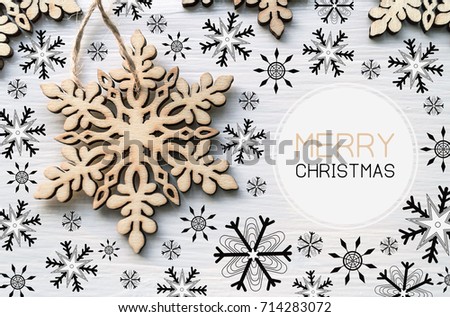 merry christmas card decorated with wooden and black snowflakes