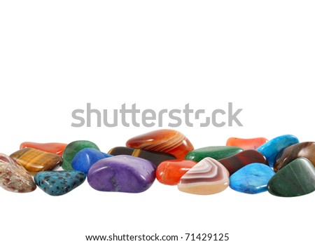 Semi-precious stones against white background with room for text Royalty-Free Stock Photo #71429125