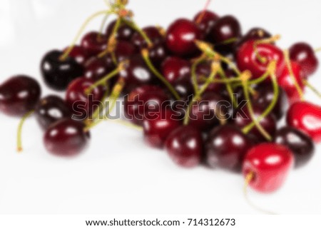 Beautiful, juicy organic cherry on a white background blurred abstract background