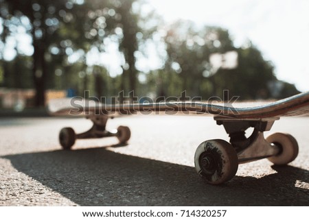 One skateboard on the road. Extreme sport challenge and skateboarder competition, close up picture of skate