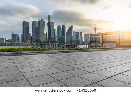 cityscape and skyline of shanghai from empty brick floor
