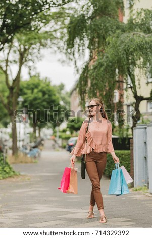 beautiful woman with shopping bags on the street