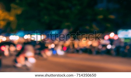 Image of Abstract Blur Street night market with bokeh for background usage .(vintage tone)