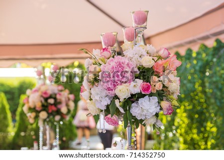floral wedding decorations pink and white. Garland, candle, lace, bouquet