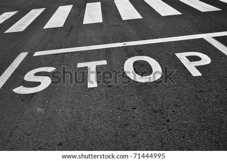a stop sign painted on the road
