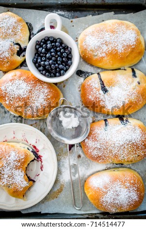 Fresh baked buns filled with blueberry jam