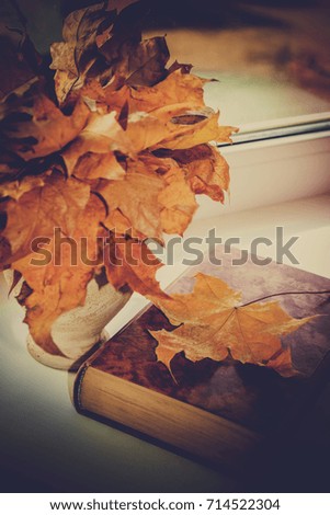 Autumn leaves and a book. Selective focus. 