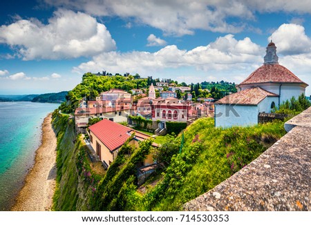 Bright view of old town Piran. Splendid spring morning on Adriatic Sea. Beautiful cityscape of Slovenia, Europe. Traveling concept background. Magnificent Mediterranean landscape. Royalty-Free Stock Photo #714530353
