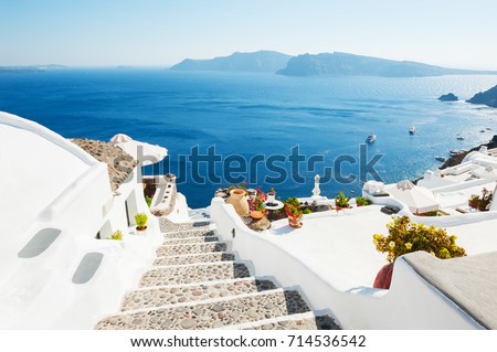 White architecture on Santorini island, Greece. Beautiful summer landscape, sea view. Royalty-Free Stock Photo #714536542