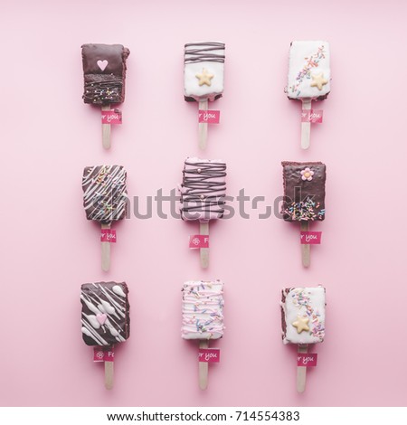 colorful chocolate ice cream  pattern  on pink background. Flat lay, top view. Valentine's background