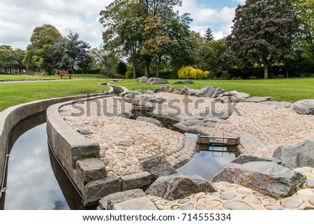 Swadlincote Park Derbyshire  water and stone feature. water chanel, rock feature with stone and pebble inlays.