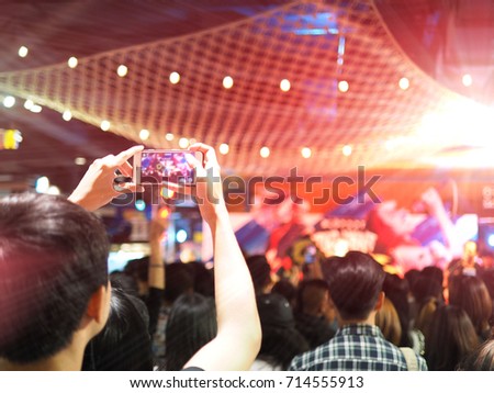 People holding their smart phones shooting video or photo concert. With copy space.