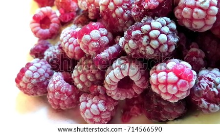 Frozen raspberry berries close up
