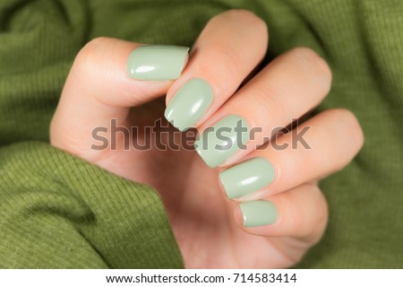 green manicure with a picture of the chip