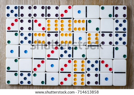 Domino tiles on wooden background