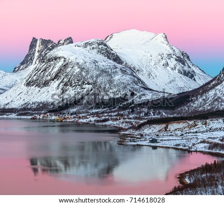 View of the beautiful fjord on Senja island with magical pink light at sunset, Troms county - Norway 