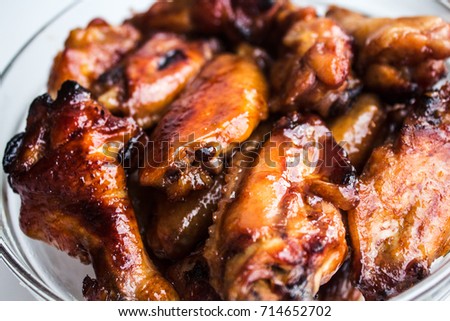 chicken wings in soy and honey sauce white background Royalty-Free Stock Photo #714652702