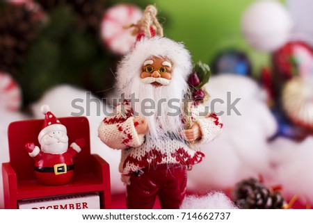 Santa Claus and New Year's calendar on December 31 on the background of a spruce wreath, a snowman and Christmas balls