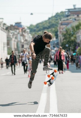Guy jumping on skateboard