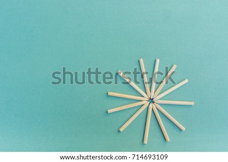 Pencil, color pencil and note paper on wood blue background, for education and business. Top view.