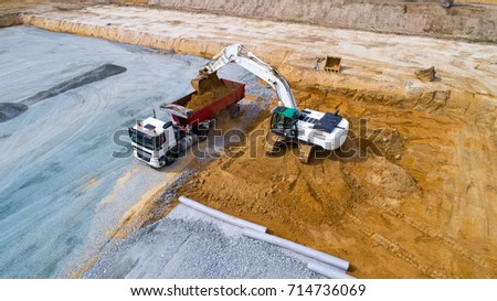 Aerial photo of a truck and an excavator working on a construction site in Treillieres, Loire Atlantique, France