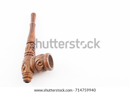 Handmade wooden pipe, hand crafted. Smoking instrument. White background.
