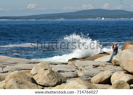 Senior Man taking Pictures at the Ocean (Cranberry Cove, Nova Scotia Canada)