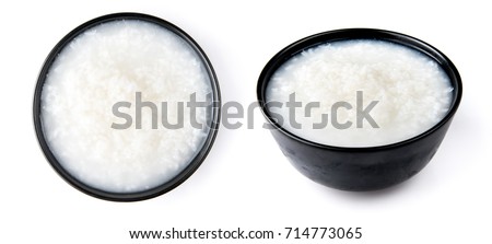 Mush or boiled rice in bowl isolated on white background Royalty-Free Stock Photo #714773065