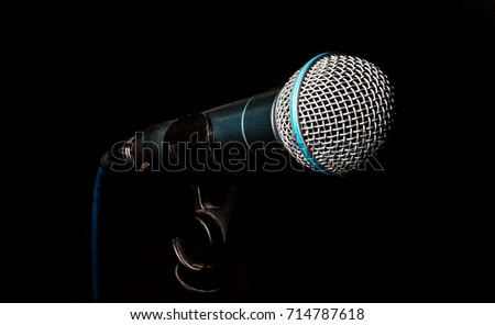 microphone on a stand, isolating on a black background