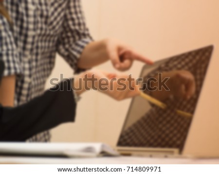 The blurry design background of Business colleagues working together,at office hour,office work,busy hur work time of  the business worker,business teamwork,join work together.blurry light background.