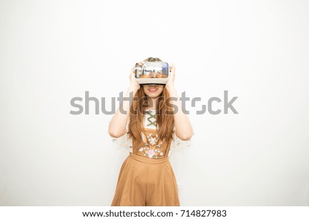 Asean woman in brown dress wearing VR
