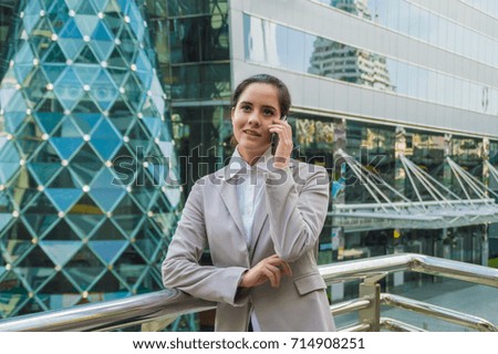 Young businesswoman look good on the outside background.