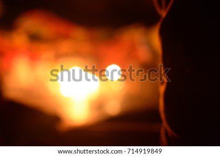 Abstract blur of candles on a cave background