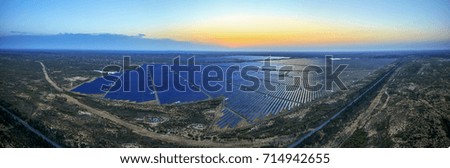 Aerial sunrise solar photovoltaic panorama