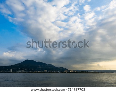mountain , river and storm clouds