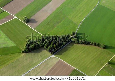 aerial view of fields and forest Royalty-Free Stock Photo #715001071