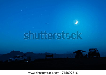 Night camping. Beautiful sky with moon over camp tents