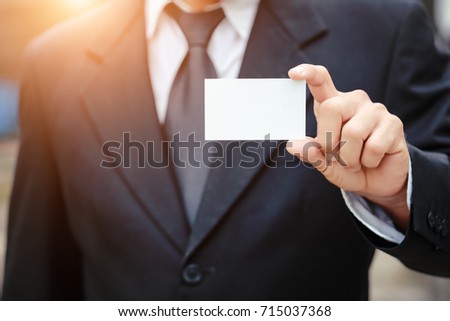 businessman giving blank name card (for insert name card concept)
