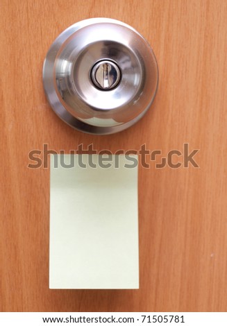 Color photo of a metal handle on a wooden door and blank Royalty-Free Stock Photo #71505781