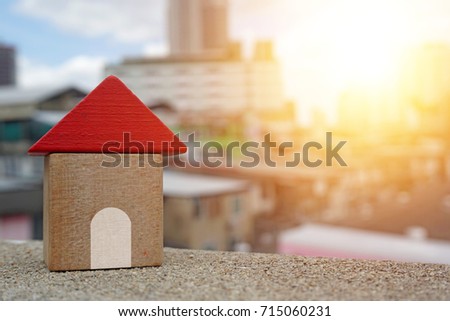 Real estate concept, Choose your best deal, buying one of this houses ,House searching concept ,Little wooden house made of toy blocks on beautiful blue sky with clouds