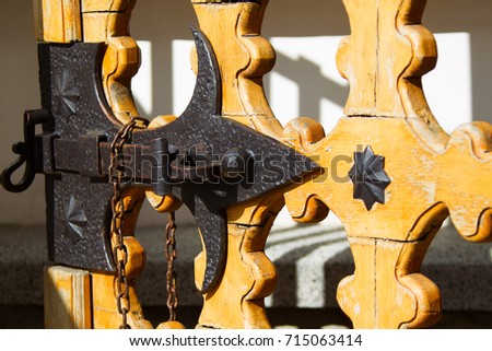 An old bolt. An ancient castle from the door. Retro key. The door bolt is iron historical