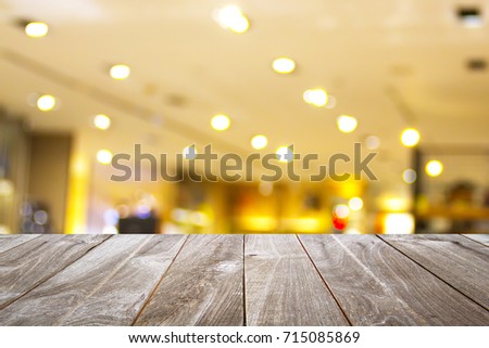 wooden table for placing products with a beautiful night restaurant backdrop, Space for placing items on the table, product and food display.